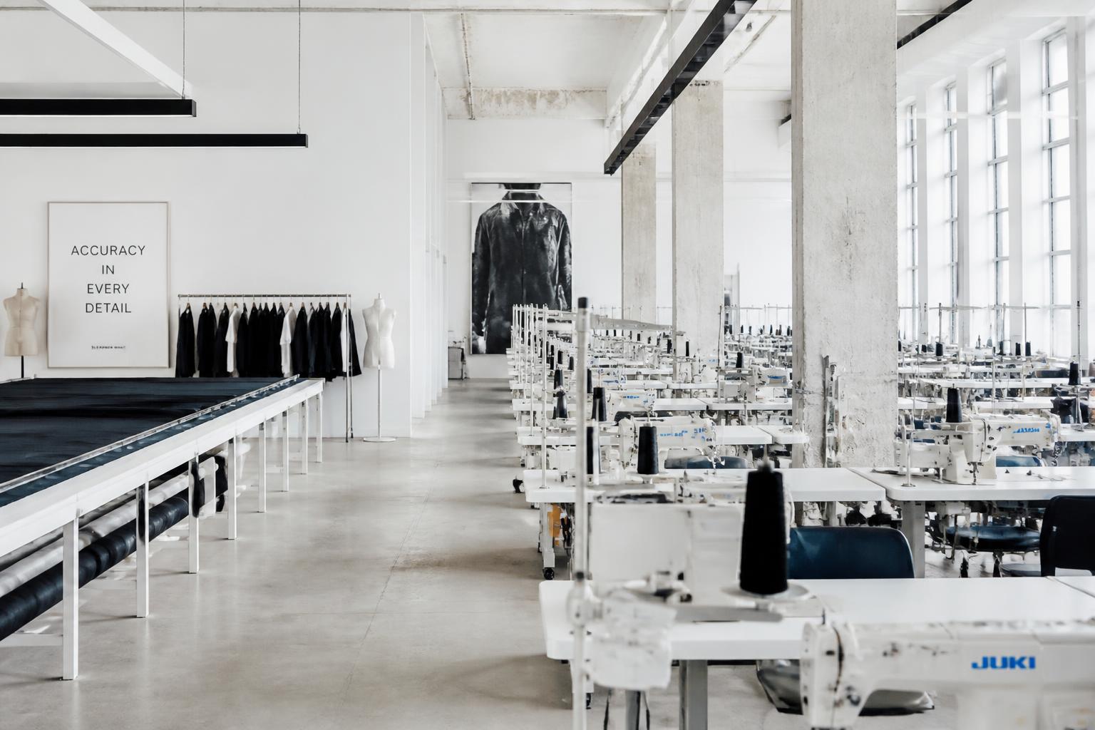 Garment production floor with sewing stations in a bright modern facility